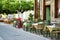 Small outdoor restaurants at the pedestrian area at center of Kalavryta town near the square and odontotos train station, Greece