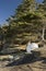 Small overturned rowboat stored on rocky shoreline, Gabriola Island, BC, Canada.