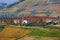 Small parish church among autumnal vineyards in Italy.