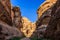 A small passage between the steep rocks at Little Petra in Siq a