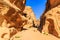 A small passage between the steep rocks at Little Petra in Siq a