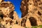 A small passage between the steep rocks at Little Petra in Siq a