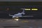 Small passenger jet airplain at an airport in the evening