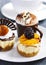 Small pastries. Mango cheesecake, classic cheesecake, coffee mousse in chocolate cup