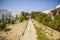 Small path between small houses on Farol island, Faro, Algarve, Portugal