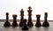 Small pawn on chess board against larger adversary concept of adversity ,discimination ,equality .focus on forground