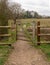 Small pedestrian gate on path in rural countryside
