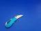 A small penknife with a sky blue handle that looks like it\\\'s starting to break