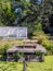 Small picnic area next to an old greenhouse in the Roosendael Abbey in Walem