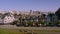 Small picturesque old painted victorian houses with fountain and contrast modern downtown cityscape in San Francisco