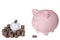 Small piggy bank with piles of quarters, large piggy bank with s