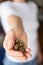 Small pile of coins in a female hand. Concept of crisis and saving money.