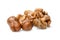 A small pile of peeled hazelnuts and walnuts. White isolated background. Close-up.