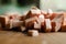 A small pile of sliced sausage for cooking on a wooden table