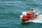 Small pilot boat sailing in the ocen