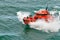 Small pilot boat sailing over the wave