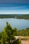 A small pine tree dominates the foreground as you look out over Greer`s Ferry lake