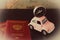 Small pink car with a compass on the roof and passports on a background of vintage maps, travel concept, view from above