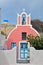 Small pink chapel on santorini island, greece