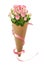 Small pink rose flowers in a paper cornet with pink ribbon