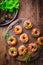 Small pizza in donut shape with rocket arugula and fresh salad