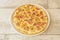 Small pizza recipe with Italian carbonara sauce with guanciale, mushroom slices, melted cheese