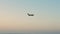 Small plane is landing over the sea. Propeller plane is landing closeup.