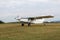 A small plane lands on the airfield