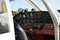 Small plane on the runway, airplane barn, Cockpit of small private lightweight vintage airplane closeup image