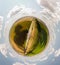 Small planet with a view of a bridge and wheatfields under the blue sky in Moldova, spherical panorama on DJi Mavic Mini 2