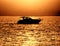 Small Pleasure Boat Craft Sailing at Sea at Sunset