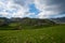 A small plowed field on a farm. Beautiful old mountain village