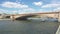 A small police boat swims under Bolshoy Moskvoretsky Bridge