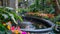 A small pond reflects the vibrant colors of the surrounding flowers providing a tranquil oasis in the midst of the