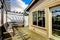 Small porch with benches in the back of the house.