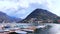 Small port on Lake Lugano against the Monte San Salvatore, Lugano, Switzerland