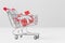 Small present box in miniature shopping cart model