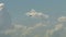 Small private airplane flying in sly background of