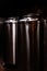 Small private brewery. Industrial stainless steel fermentation vats