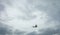 Small private plane flying in cloudy sky. White crop duster flight