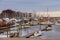 Small private yachts pier in winter Pier with rows of small private yachts