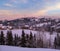 Small and quiet alpine village and winter sunrise snowy mountains around, Voronenko, Carpathian, Ukraine