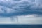 Small rain over the sea from a cloud