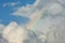 Small rainbow inside clouds
