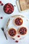 Small raspberry tarts on bright background