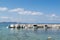 Small recreational boats moored on the stone pier