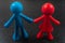 Small red and blue plastic toy copleFigurines of an couple