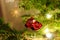 Small red car bauble on Christmas tree. Xmas decoration.