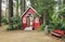 A small red chapel in a forest, Portland OR.