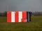 Small red-white booth on the airport